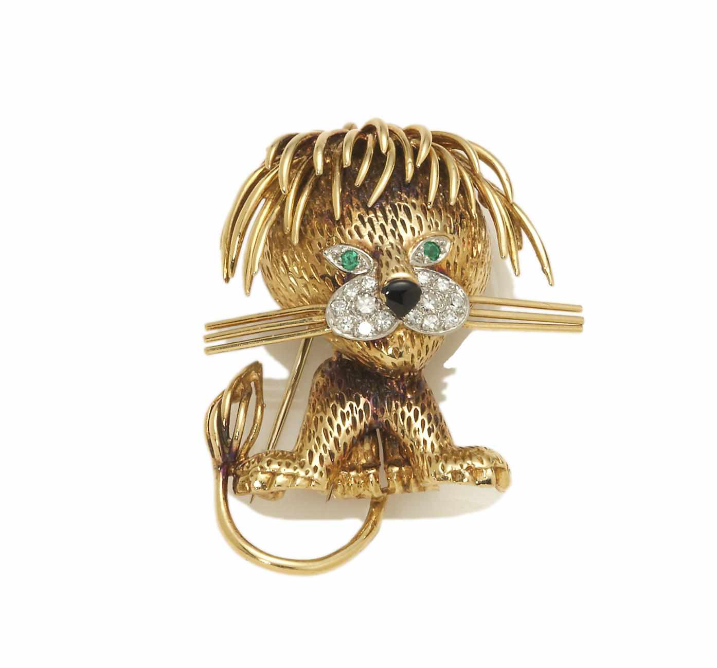 Appraisal: A diamond emerald enamel and eighteen karat gold lion brooch