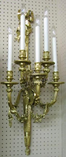 Appraisal: A pair of French style cast bronze wall sconces with