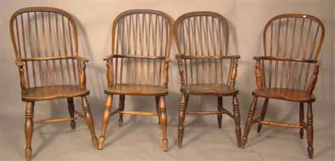 Appraisal: FOUR ELMWOOD AND YEWWOOD WINDSOR ARMCHAIRS th century and later