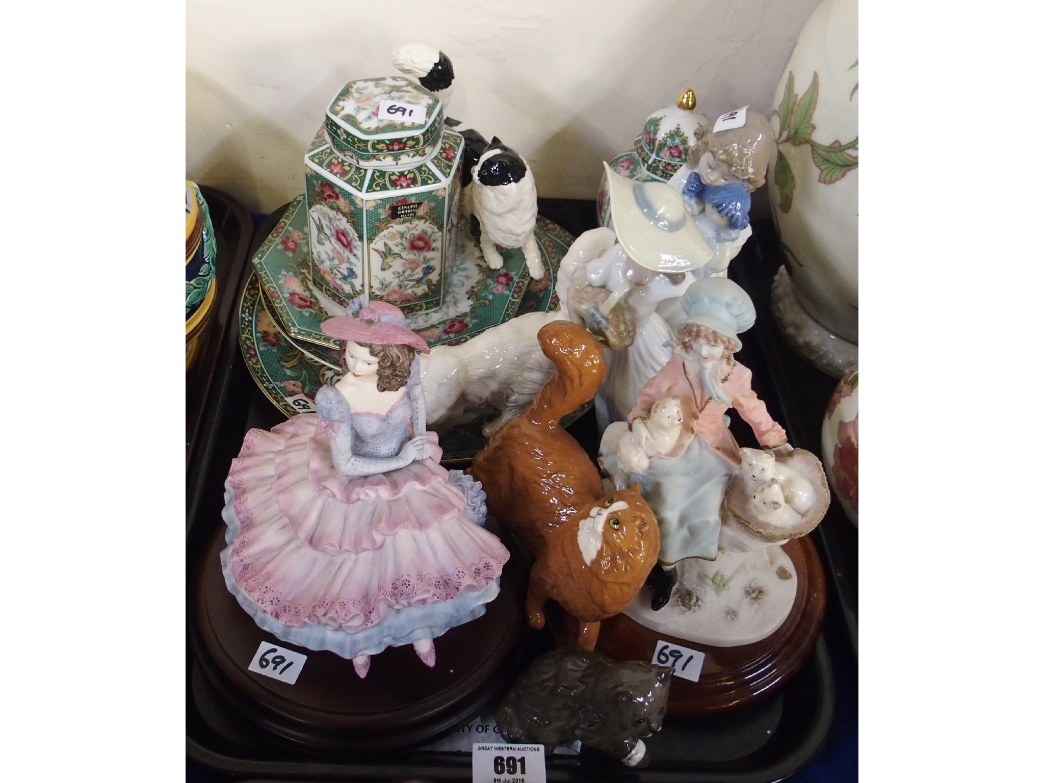 Appraisal: Four Royal Doulton cat figures two Nao figures of girls