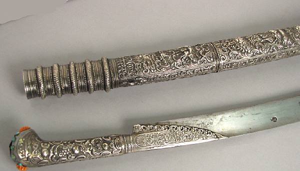 Appraisal: A silver-mounted Turkish yataghandated The inch single edged blade with