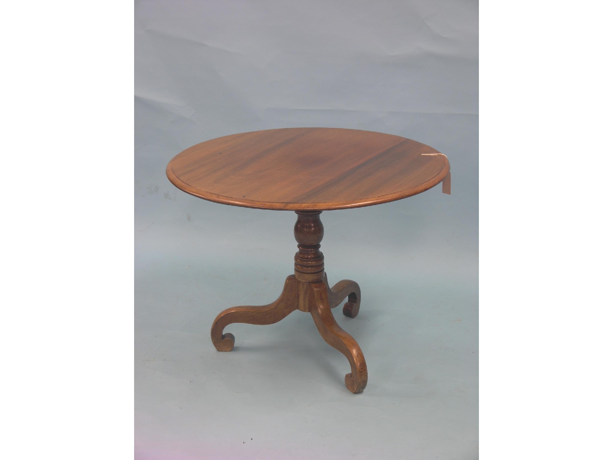 Appraisal: A Victorian mahogany tripod table circular top on turned stem