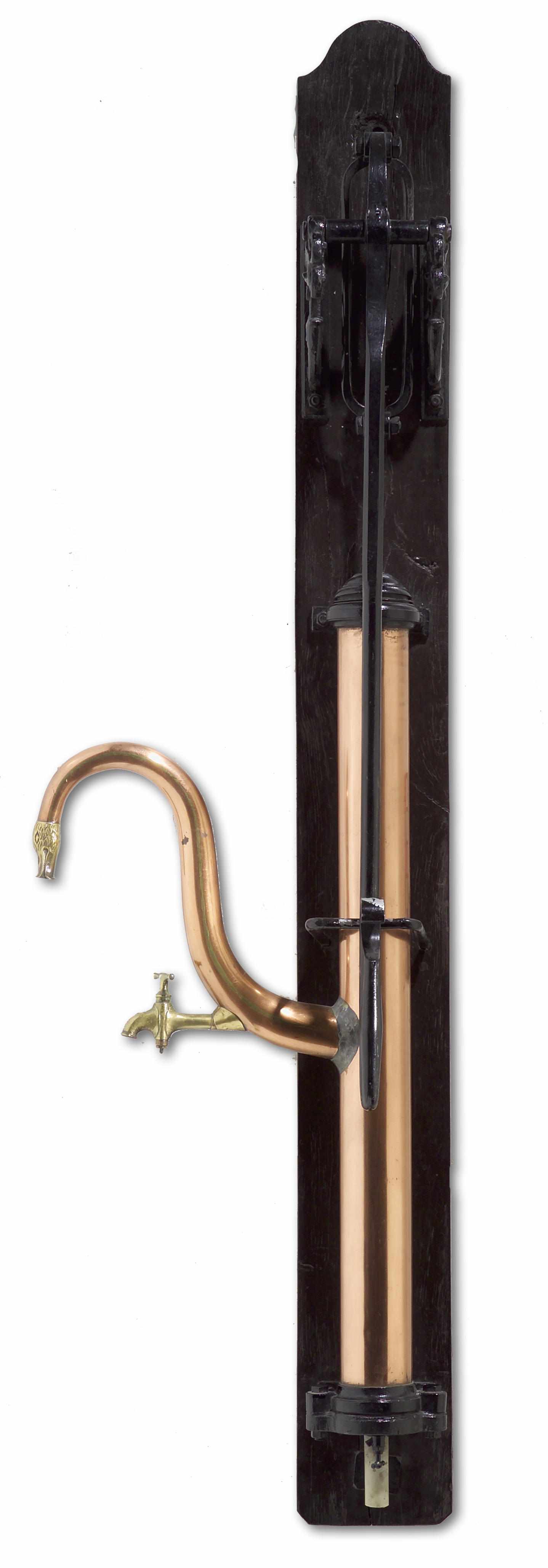 Appraisal: A French copper brass and ebonized metal water pump th