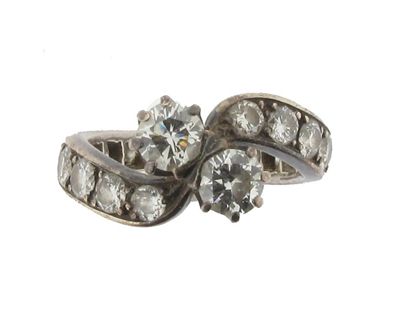 Appraisal: A diamond cross-over ring Set with two circular cut diamonds