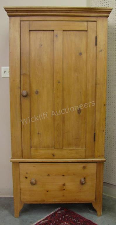 Appraisal: A pine single-door armoire with large drawer in lower two