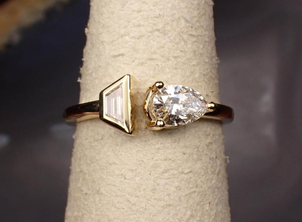 Appraisal: DIAMOND AND FOURTEEN KARAT GOLD RING East-West design bezel set