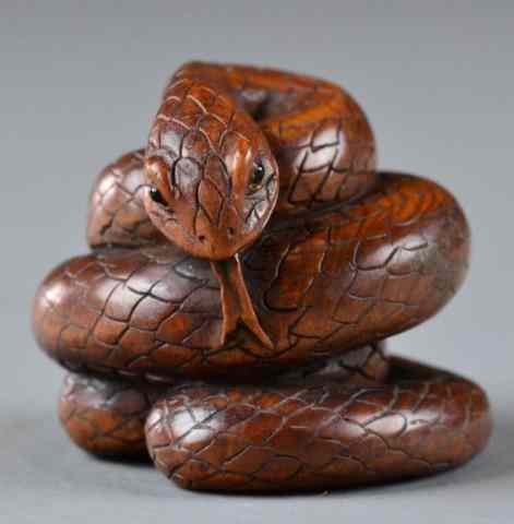 Appraisal: A Fine Japanese Carved Boxwood NetsukeFinely carved to depict coiled