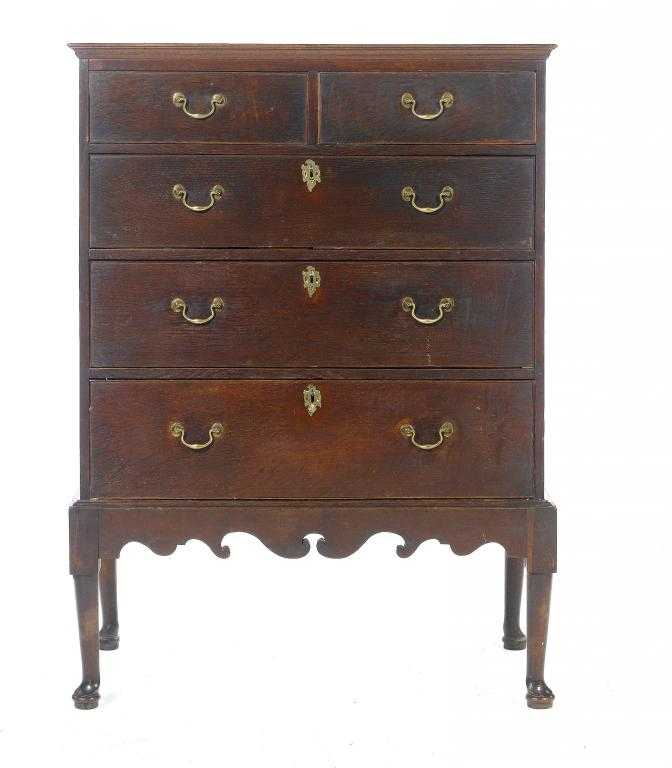 Appraisal: A GEORGE III OAK CHEST ON STAND with cavetto cornice