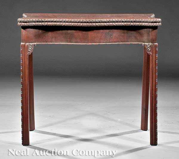 Appraisal: A Chippendale-Style Carved Mahogany Games Table th c serpentine fold-over