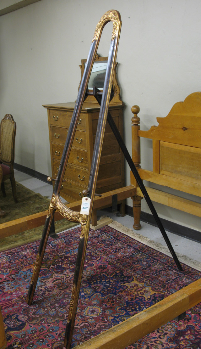 Appraisal: CARVED AND PARCEL-GILT MAHOGANY FLOOR EASEL of tripod design standing