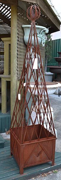 Appraisal: A PAIR OF IRON LATTICE OBELISKS WITH POTSeach obelisk topped