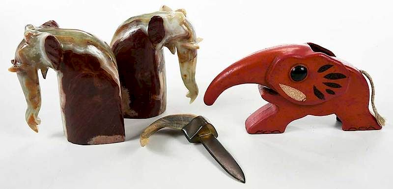 Appraisal: Elephant Group with Onyx Bookends Nutcracker th century four objects