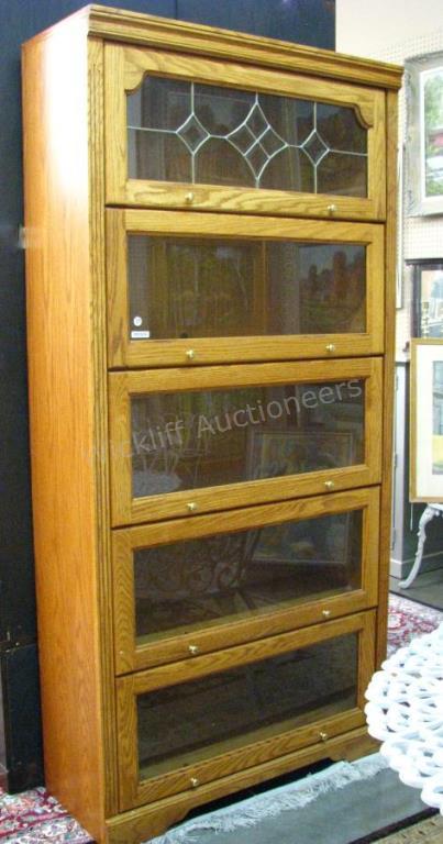 Appraisal: An oak lawyer's bookcase with five glass doors leaded glass