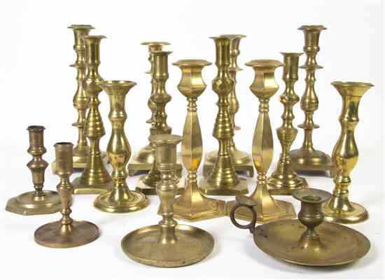 Appraisal: A Collection of Brass Candlesticks of various forms and sizes