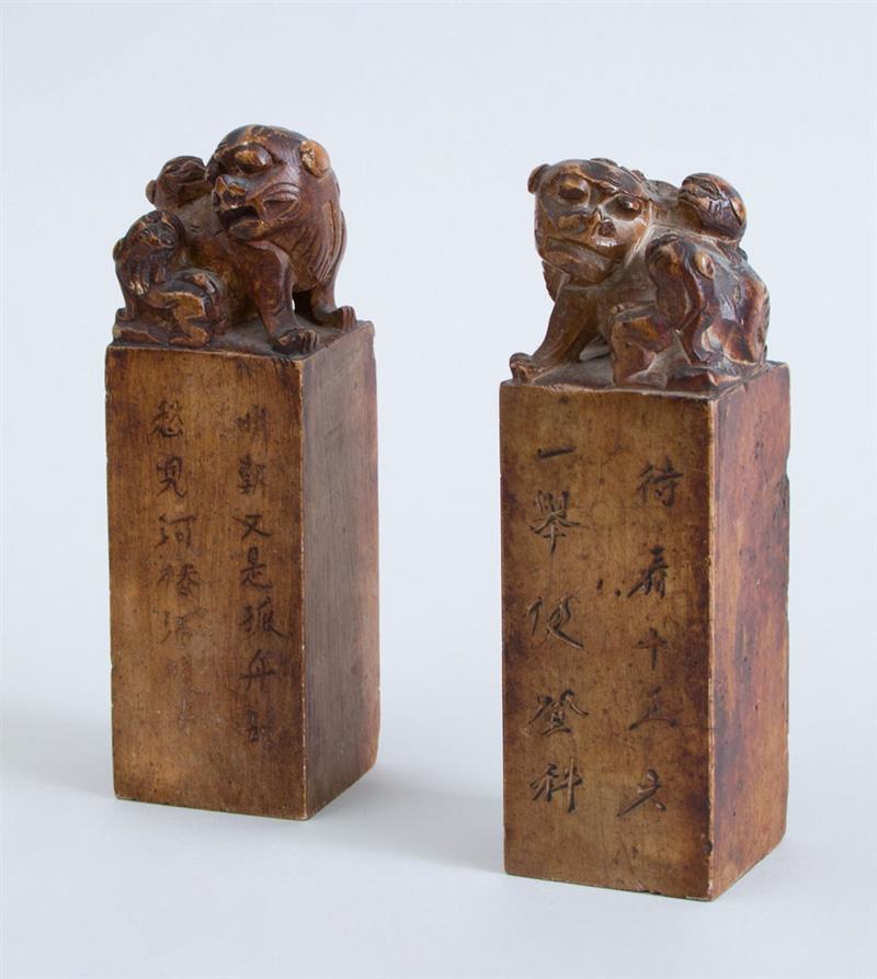 Appraisal: PAIR OF CHINESE CARVED SOFTSTONE CHOPS WITH FU DOGS AND