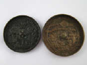 Appraisal: Two oriental bronze mirrors cm and cm diameter