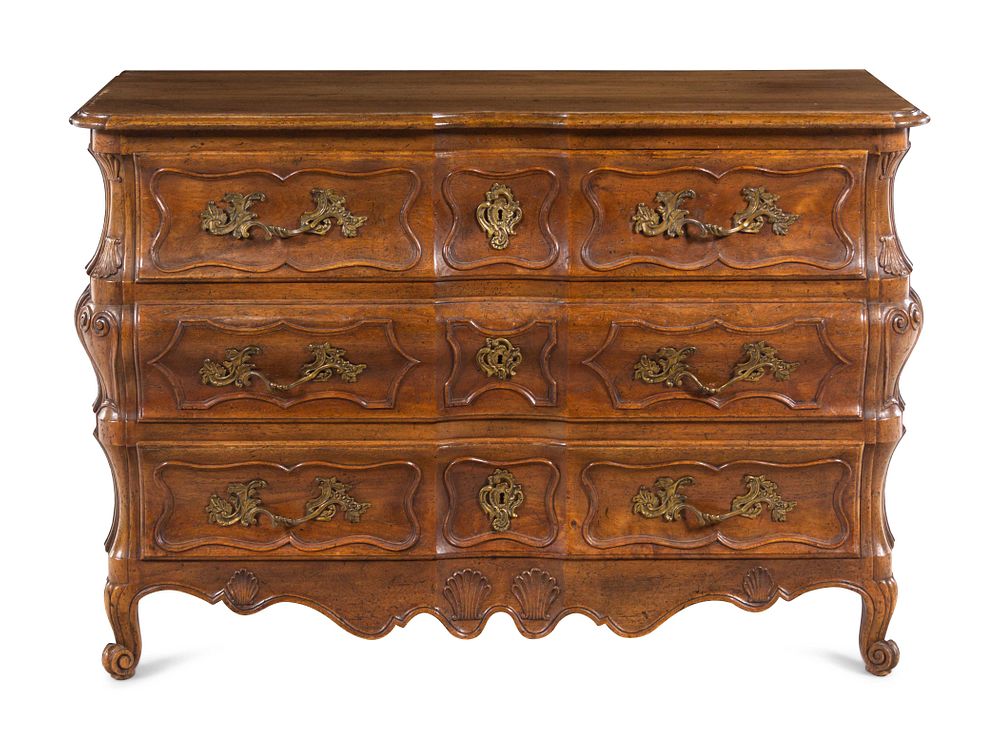 Appraisal: A French Provincial Shell-Carved Walnut Commode A French Provincial Shell-Carved