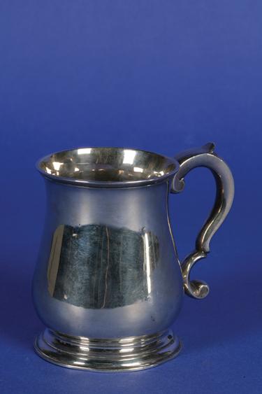 Appraisal: A GEORGE II MUG of baluster form with a scroll