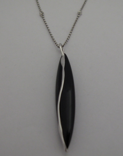 Appraisal: BLACK ONYX AND KARAT WHITE GOLD PENDANT NECKLACE The pendant