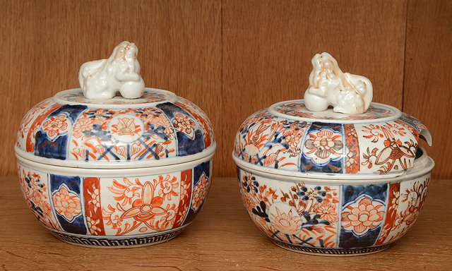 Appraisal: A PAIR OF ORIENTAL IMARI POTS AND COVERS each surmounted