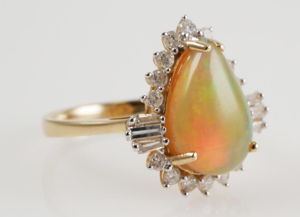 Appraisal: Set in K yellow gold pear cabochon opal approx ct