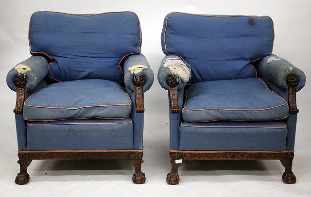 Appraisal: A PAIR OF BLUE UPHOLSTERED OAK FRAMED CLUB ARMCHAIRS each