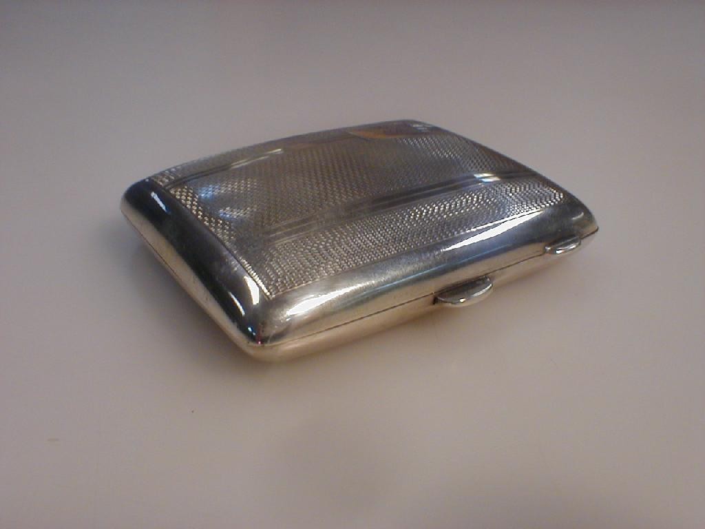 Appraisal: An engine turned silver cigarette case Birmingham assay