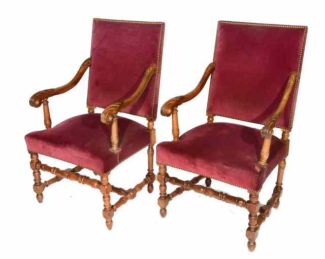 Appraisal: A PAIR OF TH CENTURY STYLE WALNUT ARMCHAIRS with carved