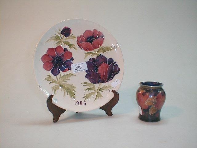 Appraisal: A Moorcroft pottery plate painted with anemones against a cream