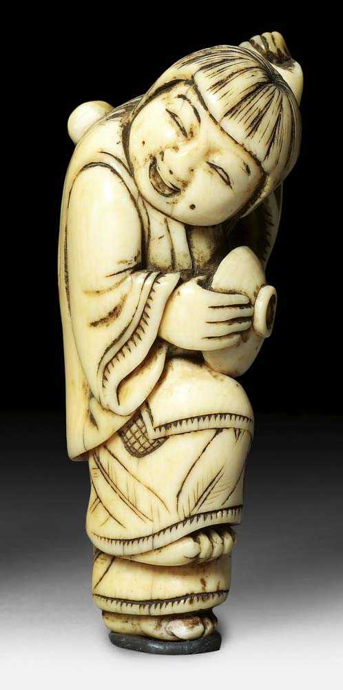 Appraisal: IVORY NETSUKE OF A SHOJO Japan th century H cm