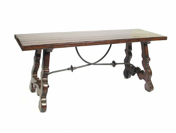 Appraisal: A Spanish Baroque style walnut and wrought iron table height