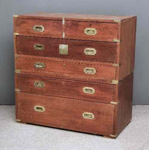 Appraisal: A late Victorian brass bound teak military chest in two