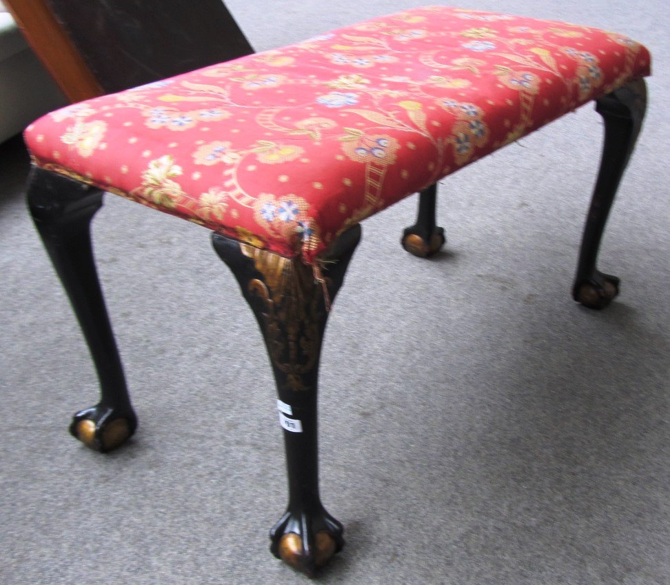 Appraisal: A rectangular footstool on parcel gilt ebonised supports with ball