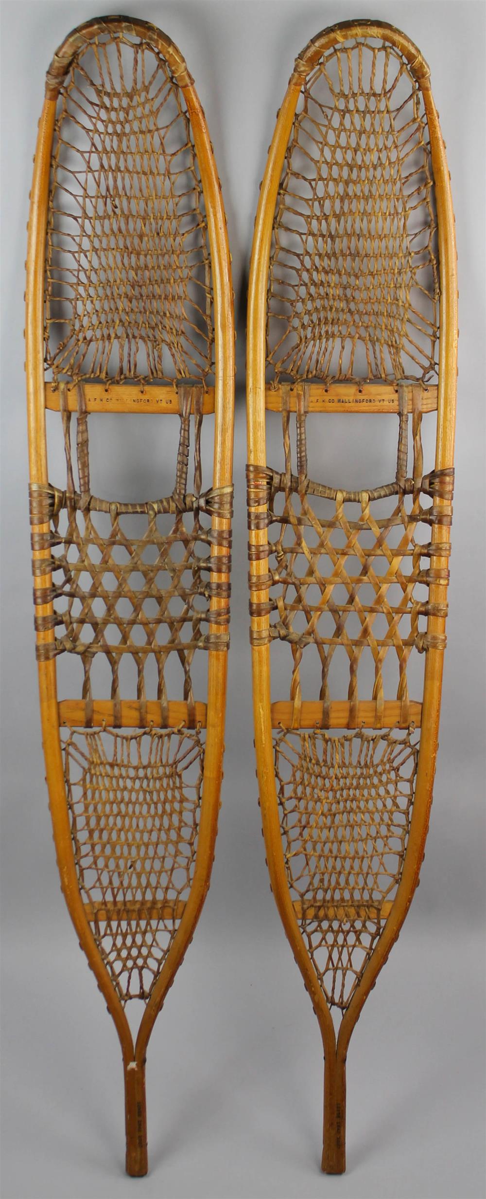 Appraisal: PAIR OF VINTAGE HANDMADE BENT WOOD AND LACED RAWHIDE SNOWSHOES