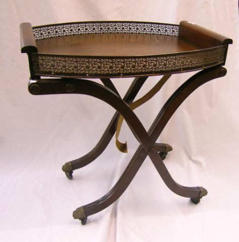 Appraisal: Mahogany serving tray with reticulated metal gallery on folding base