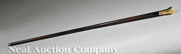 Appraisal: A Rare Gold and Cherrywood Stiletto Cane Presented from the