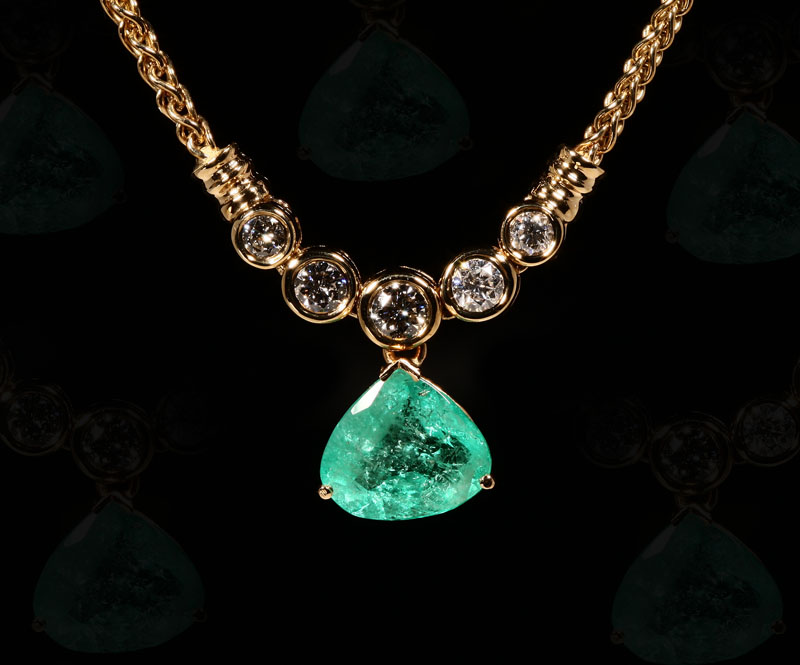 Appraisal: A K yellow gold emerald and diamond necklace Centering a