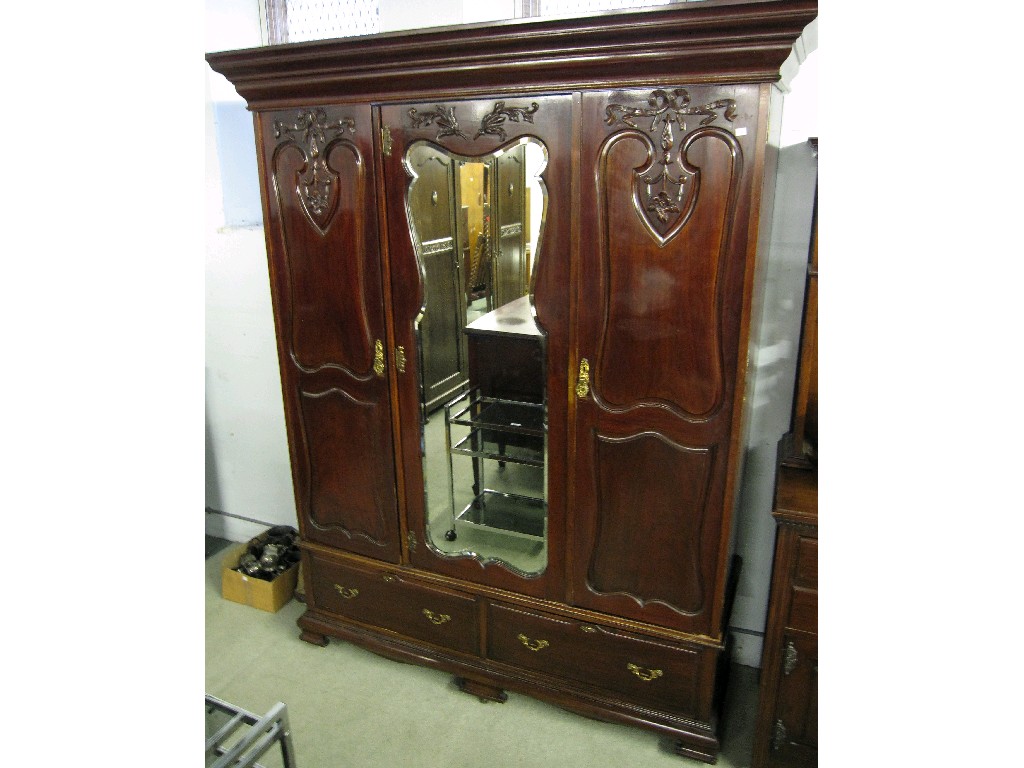 Appraisal: Victorian mahogany mirror door triple wardrobe