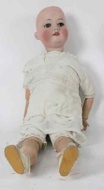 Appraisal: An Armand Marseille bisque head doll with brown weighted eyes