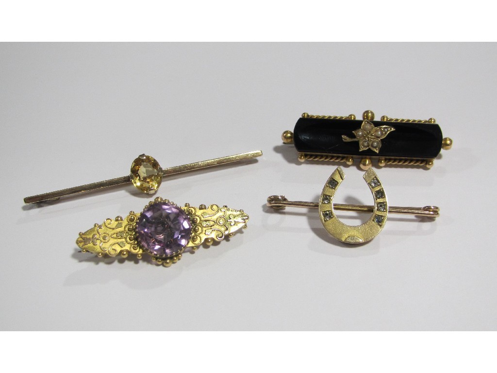 Appraisal: A lot comprising three Victorian gold bar brooches one with