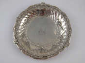 Appraisal: An antique Continental cast white metal tests silver dish in