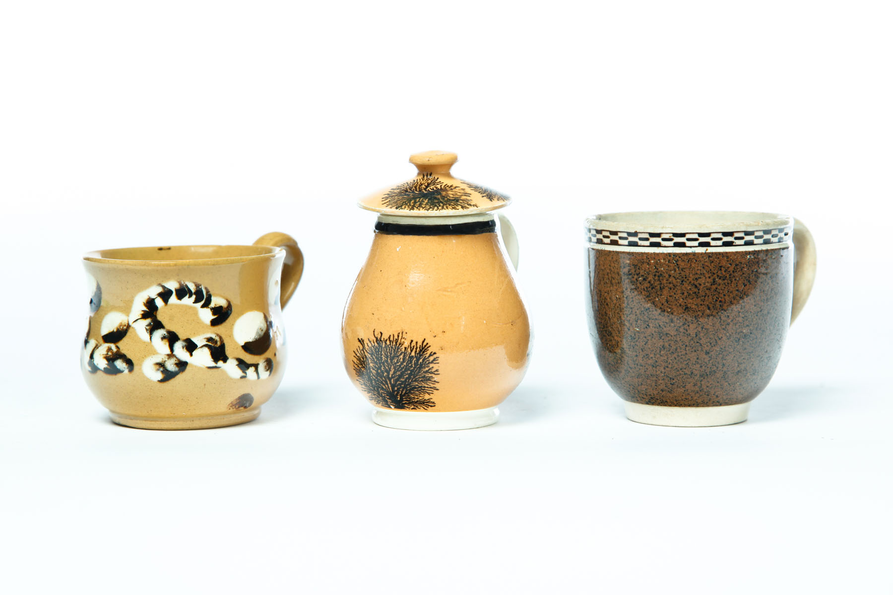 Appraisal: MUSTARD AND TWO CUPS England mid th century Mocha mustard