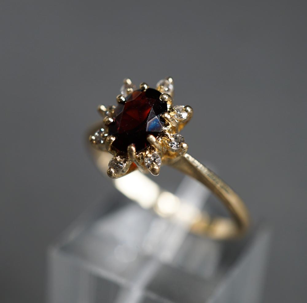 Appraisal: -KARAT YELLOW-GOLD GARNET AND DIAMOND RING GROSS DWT SIZE -Karat