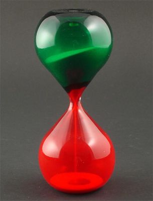 Appraisal: An Italian glass egg timer probably Venini red and green