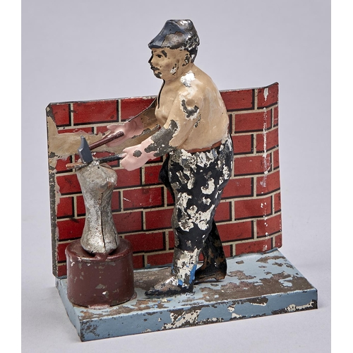 Appraisal: A mechanical lithographed tinplate figural blacksmith at the anvil toy