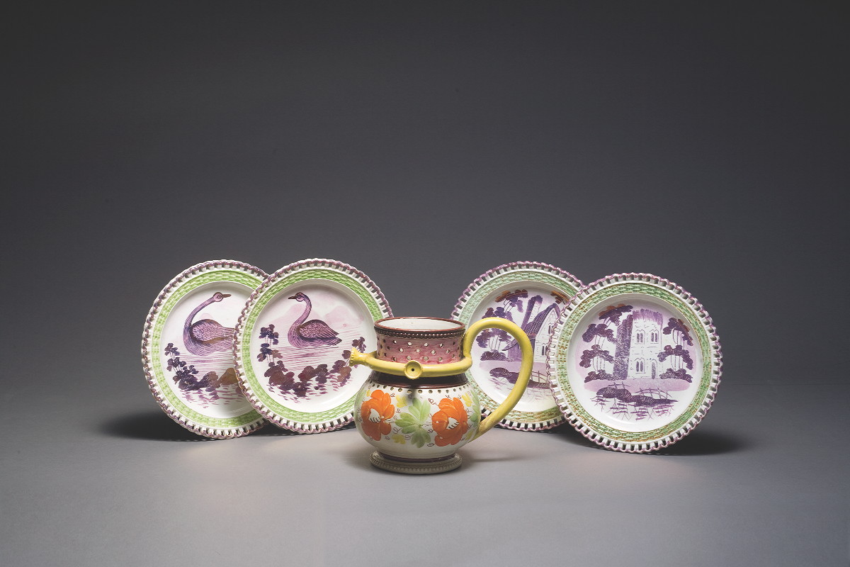 Appraisal: FOUR WELSH PURPLE-PINK LUSTRE AND ENAMEL-DECOATED PLATES DILLWYN CO SWANSEA