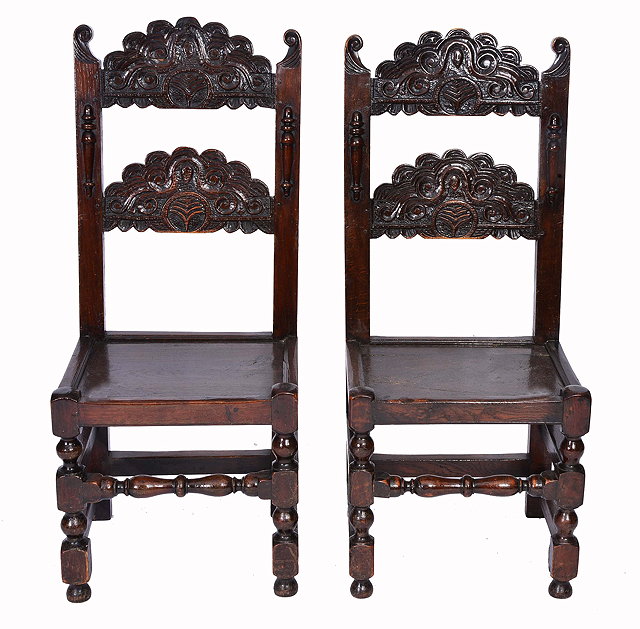 Appraisal: A PAIR OF TH CENTURY STYLE OAK DINING CHAIRS each