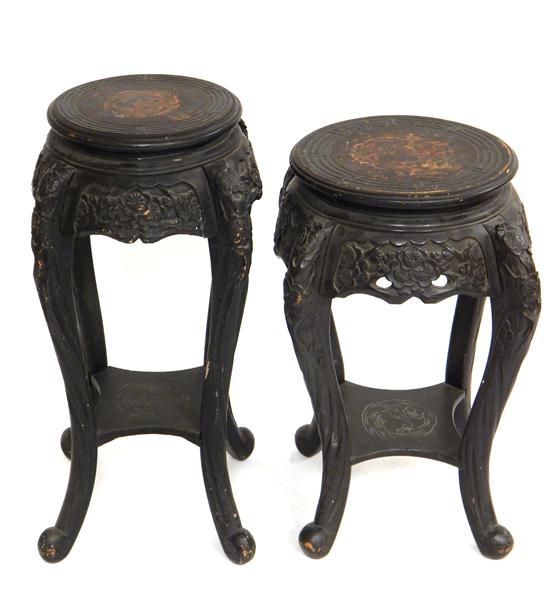 Appraisal: Pair of ebonized Chinese stands round tops with carved geometrically