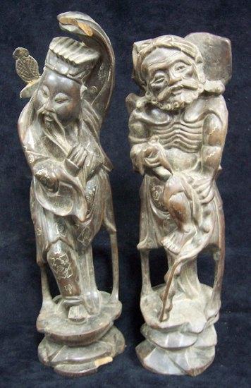 Appraisal: A pair of Oriental carved wood and inlaid figures cm