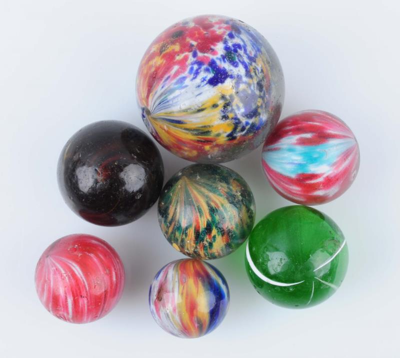 Appraisal: Lot Of Handmade Marbles Lot includes four multicolor onionskin one